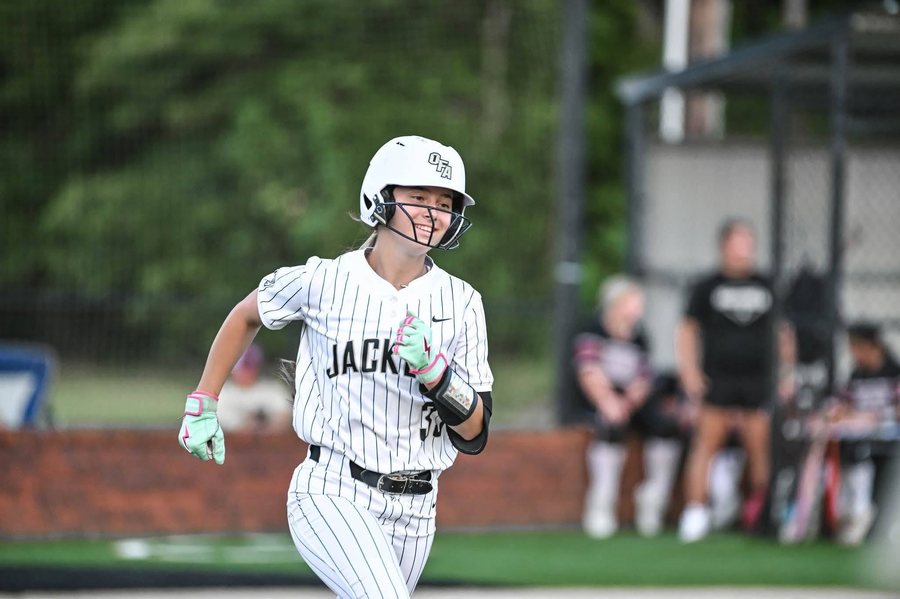 Kali Hinson running and smiling on the base path