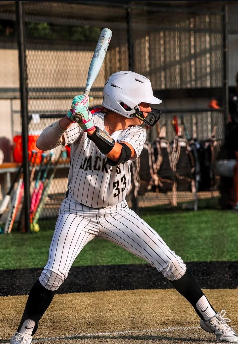 Kali Hinson at bat in her Oak Forest Academy uniform, number 33